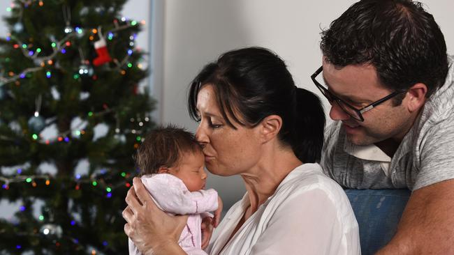 Sienna Bereza just out of the NICU has her first proper hug with mum with Elise and dad Peter. (Photo/Steve Holland)