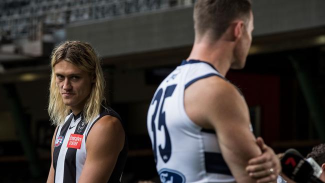 Darcy Moore of the Magpies looks on as Patrick Dangerfield of the Cats gives an interview during captain’s day. Picture: Getty Images