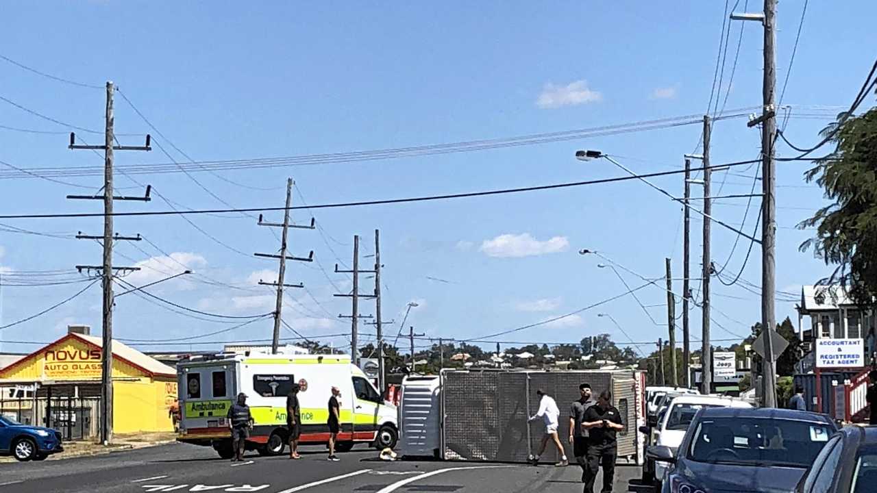 CRASH: A man in his 50's was assisted by people after his vehicle rolled at the corner of Kent and Derby St. Picture: Maddelin Mccosker