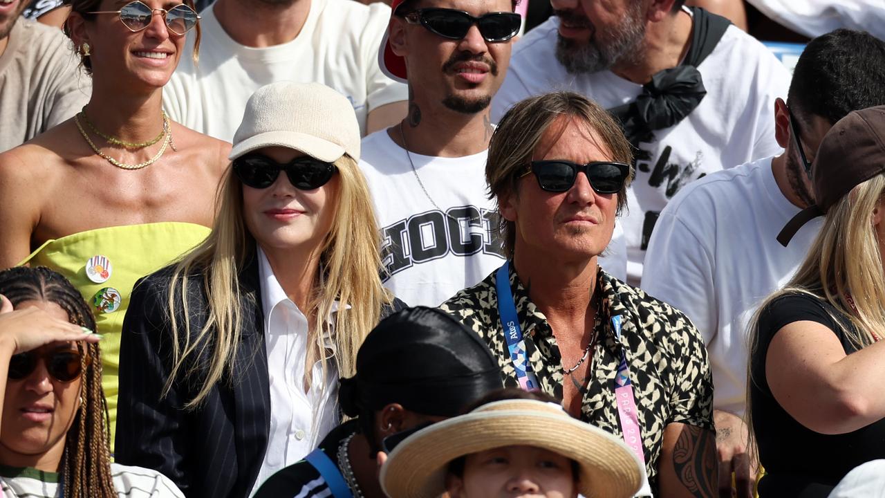 Nicole and Keith blend into the crowd at the Olympics on Sunday … Picture: Getty