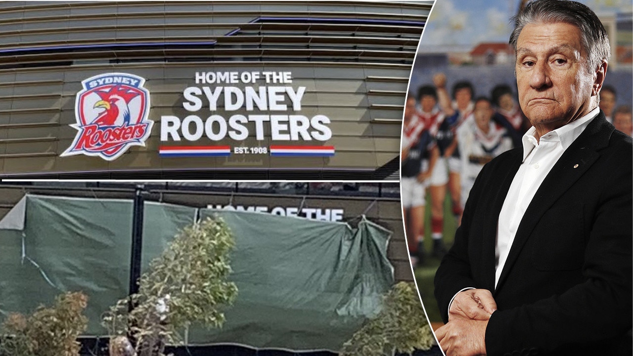 The "Home of the Sydney Roosters" sign at Allianz Stadium has been covered up by a $152 Bunnings tarpaulin.