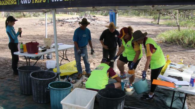 Bundaberg 4WD Club members help with the sorting of rubbish collected.