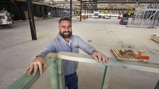 John Papantoniou at the warehouse where his vision for an entertainment park is taking shape at Bankstown Airport. Picture: Matthew Vasilescu