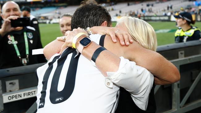 MELBOURNE, AUSTRALIA - MARCH 24: Travis Boak of the Power is embraced by his mother Chicki during the 2024 AFL Round 02 match between the Richmond Tigers and the Port Adelaide Power at the Melbourne Cricket Ground on March 24, 2024 in Melbourne, Australia. (Photo by Michael Willson/AFL Photos via Getty Images)