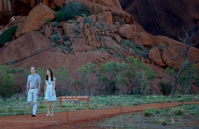 The Duke and Duchess of Cambridge return from their evening stroll to the Kuniya Waterhole during their tour of Uluru. The TRG were tasked to provide them with 24-hour protection. Picture: PHIL WILLIAMS