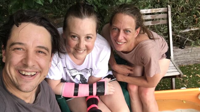 Johnson with his late sister Connie (centre) and his partner, Em (right). Picture: ABC
