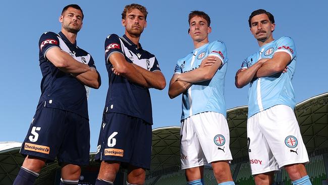 MELBOURNE, AUSTRALIA - DECEMBER 19: Brendan Hamill and Ryan Teague of the Victory pose alongside Kai Trewin and Callum Talbot of Melbourne City during a Melbourne Victory and Melbourne City A-League Derby media opportunity at AAMI Park on December 19, 2024 in Melbourne, Australia. (Photo by Morgan Hancock/Getty Images)