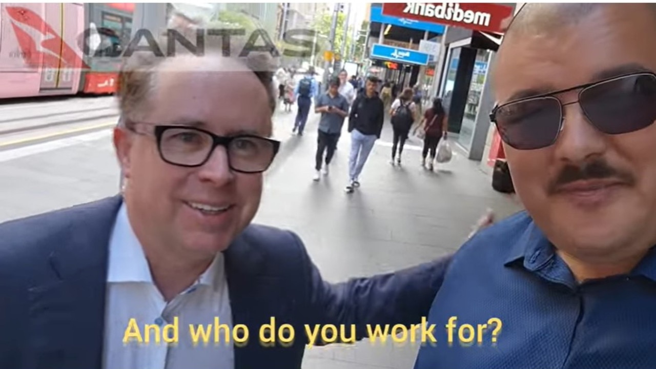 Simeon Boikov, aka the "Aussie Cossack", pretended to get a photo with Qantas CEO Alan Joyce in Sydney. Picture: YouTube / Aussie Cossack