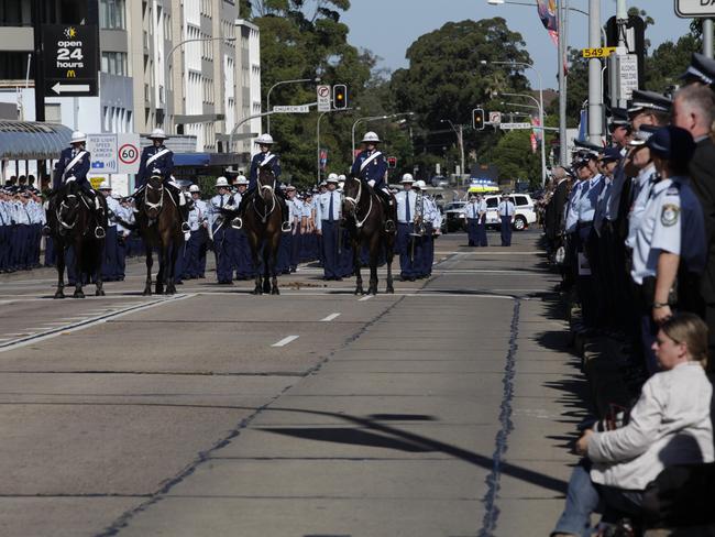 Hundreds of police and the public lined the streets of Parramatta for the decorated officer’s funeral.