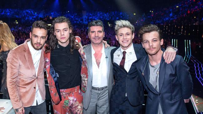 One Direction with X Factor mastermind Simon Cowell (centre). Picture: Syco/Thames/Corbis/Dymond