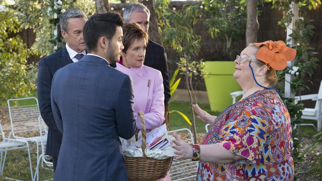 Magda Szubanski shoots a scene on Neighbours as a wedding celebrant for the first ever same-sex wedding on Australian television with Steffan Denis, Jackie Woodburne, Takaya Honda and Alan Fletcher. Picture: Channel 10