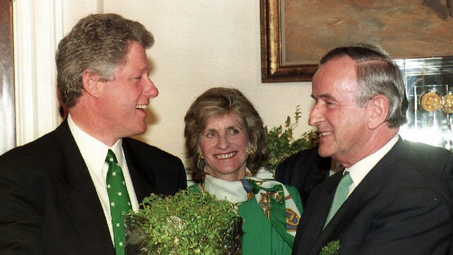 US President Bill Clinton (L), with Jean Kennedy Smith (C), accepts a bowl of shamrocks in honour of St. Patrick's Day from Irish Prime Minister Albert Reynolds in 1993.