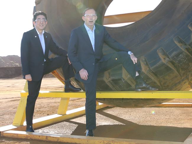 The Prime Minister Tony Abbott and the Japanese Prime Minister Shinzo Abe doing something weird.