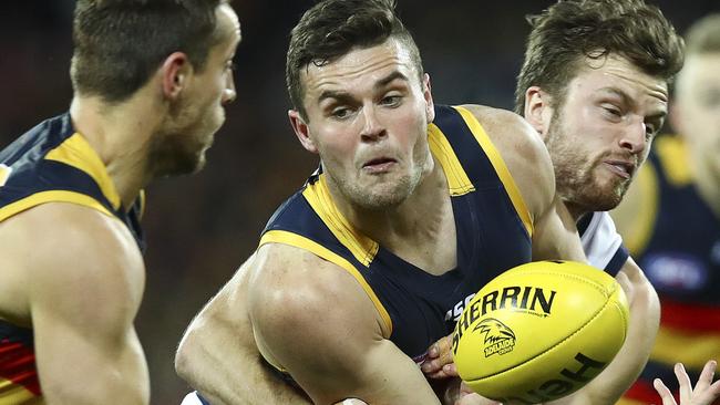 AFL - Adelaide Crows v Geelong - Round 18 - Adelaide Oval. Brad Crouch passes off to Richard Douglas. Picture Sarah Reed