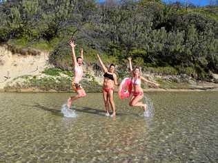 Sven Knoff, Steffi Zettelmayer and Nadine Strzempek say out of everywhere they have been, they love Fraser Island the most. Here they're pictured at Eli Creek. Picture: Crystal Jones