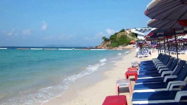 A western man whose throat was slit has been found tied to a concrete pole in the ocean near Samae Beach in Thailand. Picture: YouTube