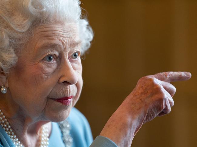 TOPSHOT - Britain's Queen Elizabeth II gestures during a reception in the Ballroom of Sandringham House, the Queen's Norfolk residence on February 5, 2022, as she celebrates the start of the Platinum Jubilee. - Queen Elizabeth II on Sunday will became the first British monarch to reign for seven decades, in a bittersweet landmark as she also marked the 70th anniversary of her father's death. (Photo by Joe Giddens / POOL / AFP)