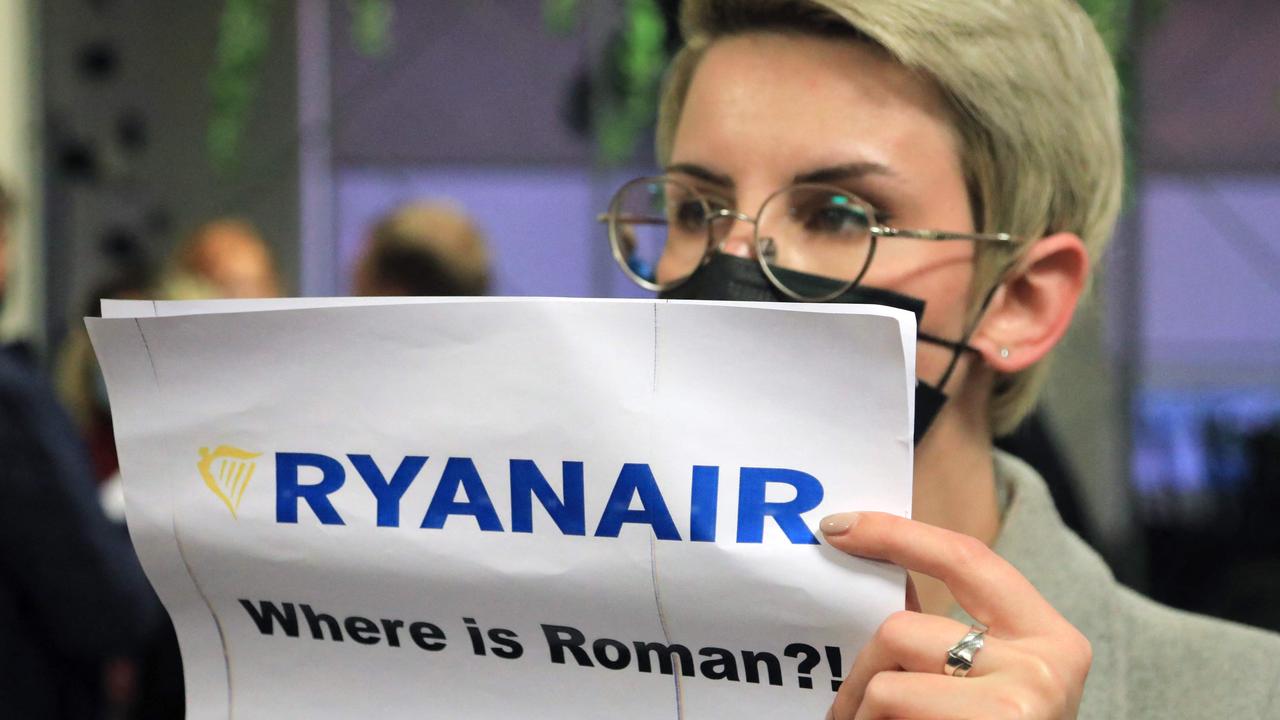 A woman stands with a poster reading 'Where is Roman (Protasevich)?!' in Athens after a plane was diverted by Belarus with the activist on board. Picture: Petras Malukas/AFP