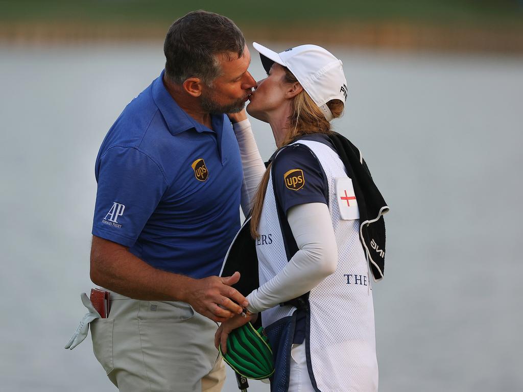 Lee Westwood kisses his caddie and partner Helen Storey after finishing on the 18th green during the third round. (Photo by Kevin C. Cox/Getty Images)