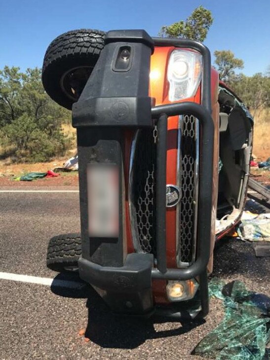 A strong gust of wind caused a car and the caravan it was towing to roll on the Stuart Highway near Elliot. Picture: NTPFES