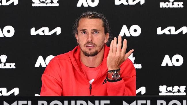 Zverev speaks to the press after the final. (Photo by Vince CALIGIURI / TENNIS AUSTRALIA / AFP)