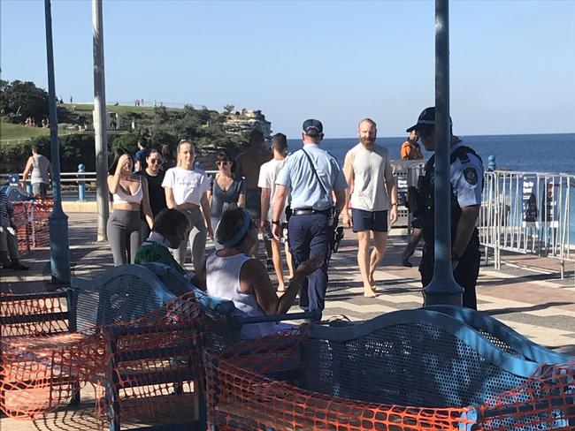 Police at Coogee Beach as people flout social distancing rules. Picture: Supplied