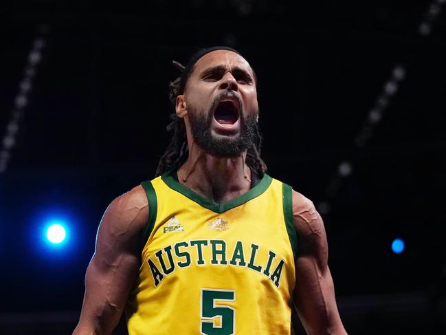 Patty Mills of Australia celebrates after making a basket in the final minutes during match 2 of the Pre-FIBA World Cup series between Australia and the USA  at Marvel Stadium in Melbourne, Saturday, August 24, 2019.  (AAP Image/Scott Barbour) NO ARCHIVING, EDITORIAL USE ONLY