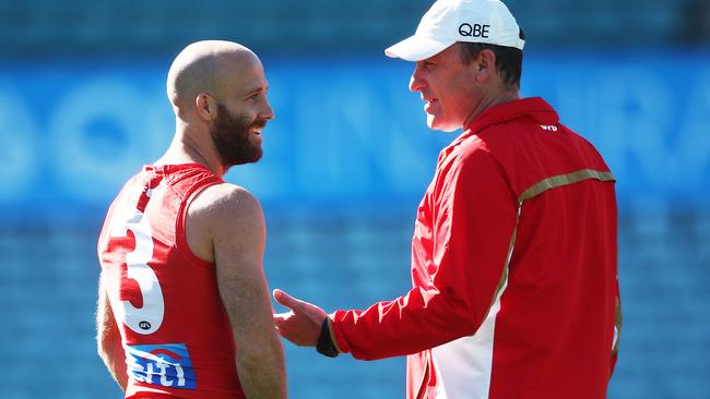 Jarrad McVeigh and coach John Longmire chat at training. Picture: Phil Hillyard