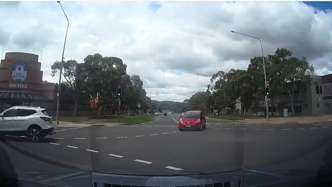 The red car doesn’t have right of way but turns. Picture: Dash Cam Owners Australia