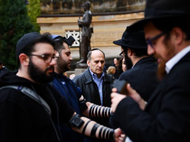 People arrive for a vigil, for the shooting at the Tree of Life synagogue the day before, at the Allegheny County Soldiers Memorial on October 28, 2018, in Pittsburgh, Pennsylvania. Picture: Brendan Smialowski