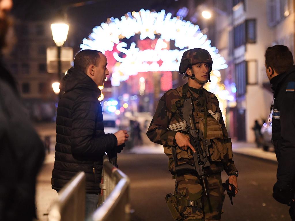 Policemen speak with a military in the streets of Strasbourg. Picture: Frederick Florin/AFP