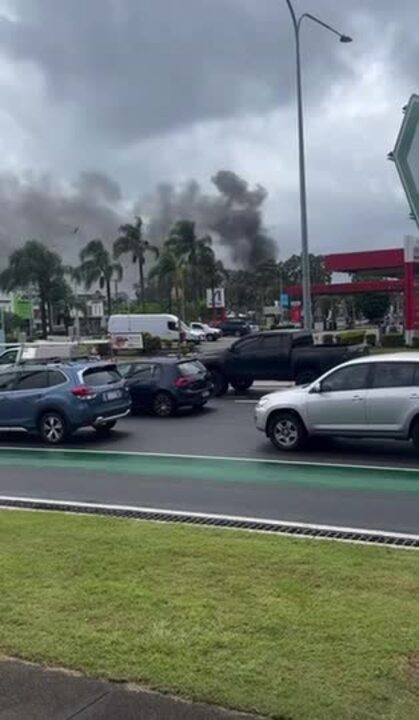 Plumes of black smoke billowed over the Gold Coast as fire crews fought to control a blaze at Gold Coast resort.