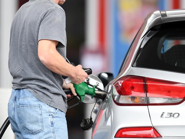 BRISBANE, AUSTRALIA - NewsWire Photos - AUGUST 10, 2021., A man fill up his car at a service station in Woolloongabba, Brisbane. Despite a drop in oil prices unleaded fuel remains high across the country's capital cities at $1.73 a litre in Brisbane, $1.63 in Adelaide, $1.55 in Melbourne and $1.45 in Sydney., Picture: NCA NewsWire / Dan Peled