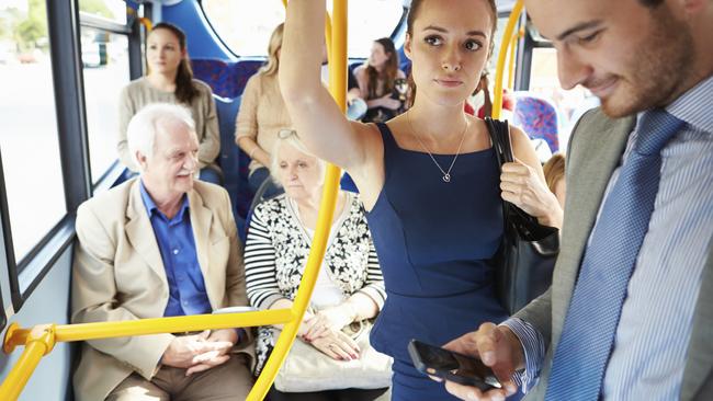 RendezView. Passengers Standing On Busy Commuter Bus.