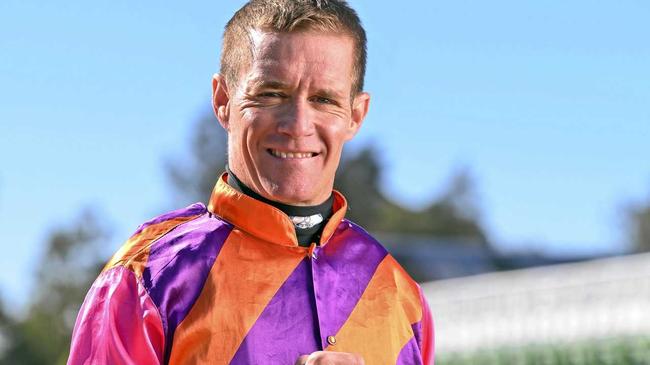 International jockey Mark Du Plessis with the Ipswich Cup. Picture: Cordell Richardson