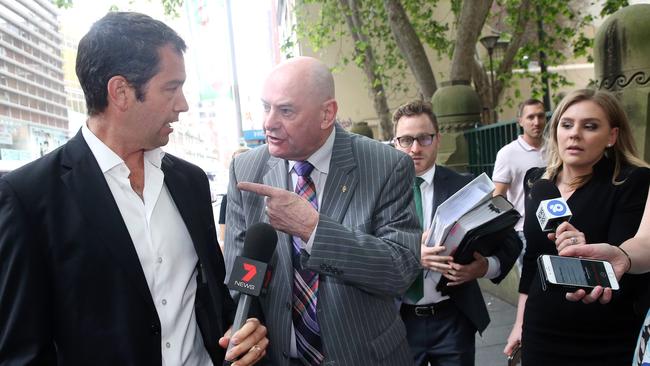 Peter Dawson confronts a reporter outside Central Local Court on Friday. Picture: Richard Dobson 