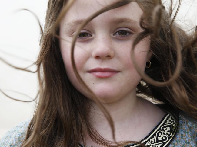 Young Viking Maiden Gabrielle Metcalfe, 9, poses for a photo at Hawkesbury Showground Winterfest Medieval Festival on Saturday, July 7, 2018. The festival drew a large crowd from the Hawkesbury area who came for the food, folk music and fun. (AAP Image/David Swift)