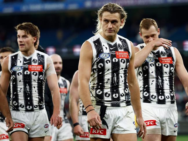 Darcy Moore leads the Magpies off the MCG. Picture: Michael Willson/AFL Photos