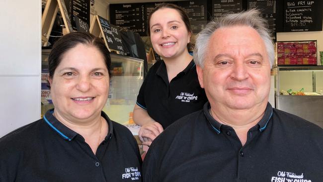 The owners of Old Fashioned Fish 'N' Chips at Narraweena, Mary and Nick Christofis, with their daughter Christina (centre). Picture: Jim O'Rourke