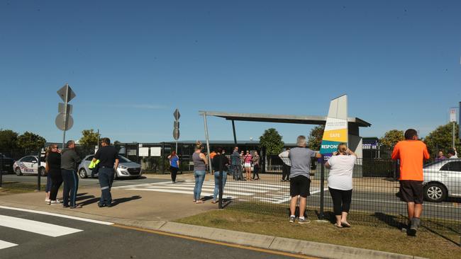 Worried parents wait outside of the school. Picture Mike Batterham