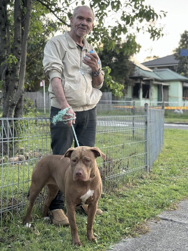 Luis Blanco and his dog, Cleopatra, following the house fire. Picture: Amaani Siddeek