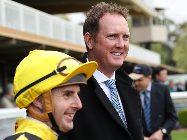 Trainer Michael Hawkes with jockey Christian Reith before his ride on Super Maxi in race 6 at Warwick Farm, Sydney. Picture. Brett Costello