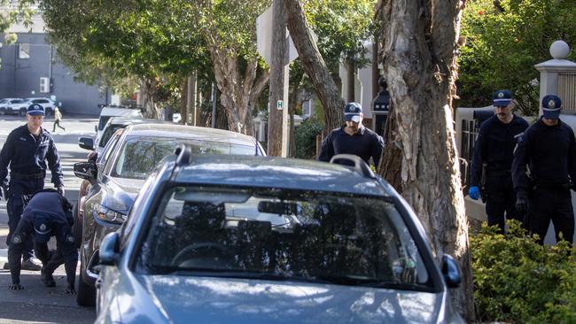 Police search surrounding streets for evidence following a gangland linked shooting in Bondi Junction on Tuesday morning. Picture: Liam Mendes / The Australian