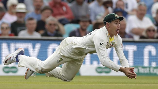 Marnus Labuschagne dives for a brilliant catch to remove Jos Buttler. Picture: Getty Images