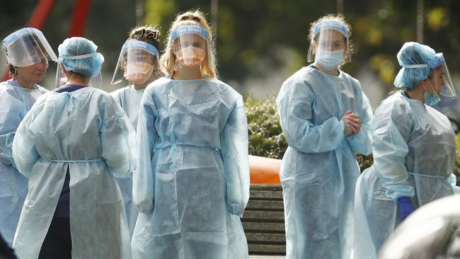 Workers outside Melbourne’s public housing towers. Picture: Getty Images