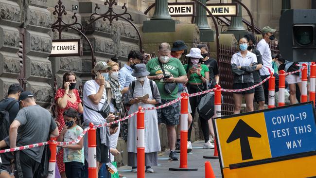 People queue for Covid-19 testing at Melbourne Town Hall. Picture: David Geraghty/NCA NewsWire