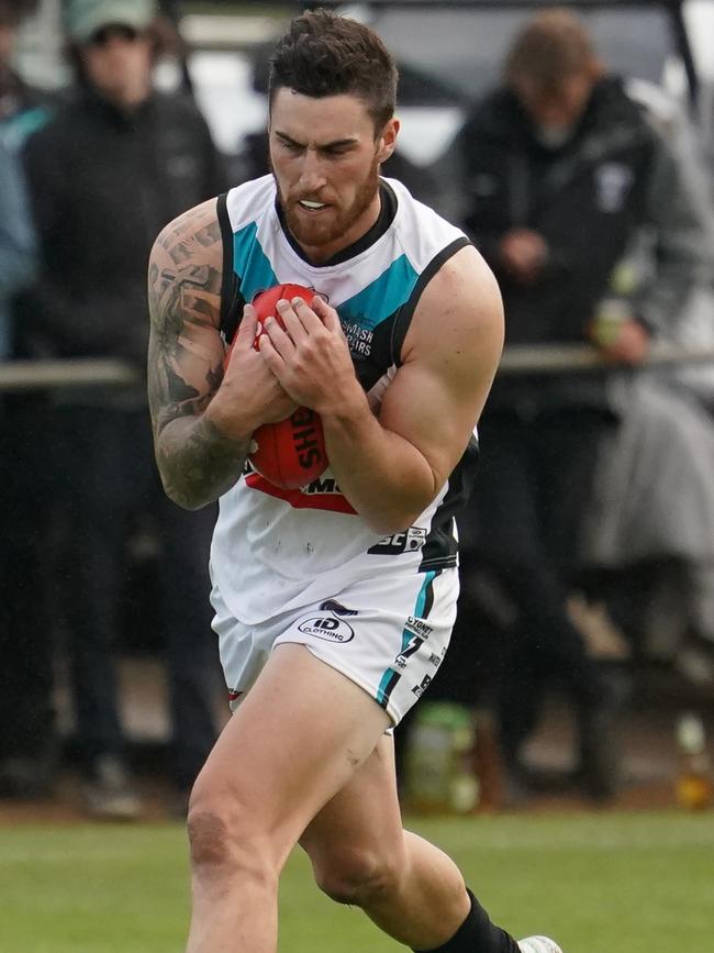 Ryan Wiggins in action for Cygnet against Huonville on Saturday April 17th. Photo courtesy of David Clark Photos