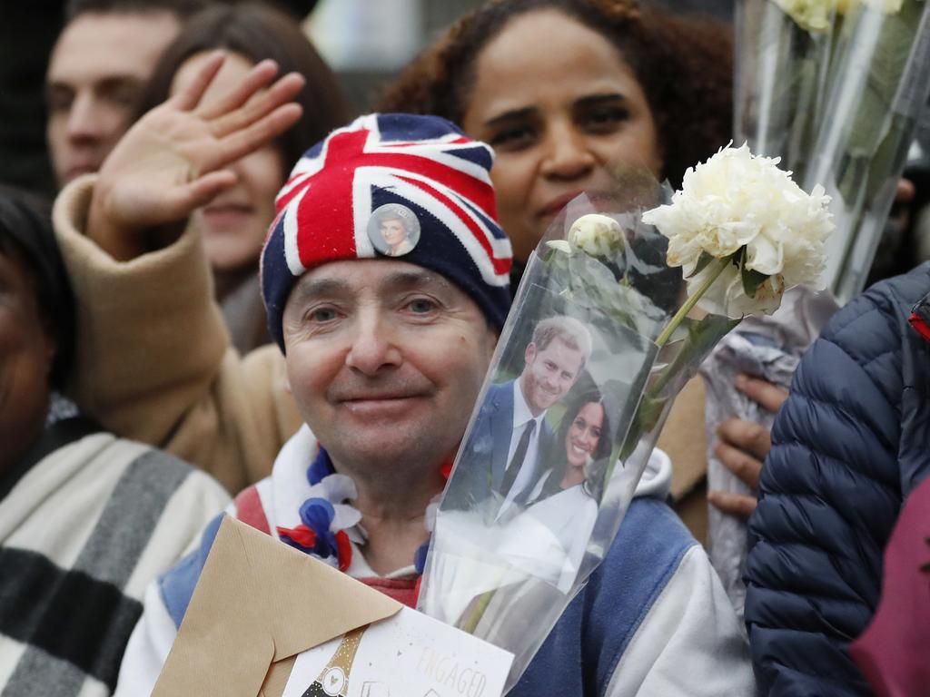 Royal fans await the arrival of Britain’s Prince Harry and his fiancee Meghan Markle for their visit to the Reprezent 107.3 FM radio station in Brixton, south London, Tuesday, Jan. 9, 2018. The royal couple will visit Tuesday to see the station’s work supporting young people through creative training in radio and broadcasting, and to learn more about their model of using music, radio and media for social impact. Picture: AFP