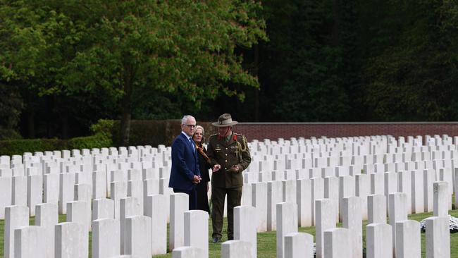 Australian Prime Minister Malcolm Turnbull and his wife Lucy visit the grave of Lucy Turnbull's grand uncle Robert Forrest Hughes at Heilly Station cemetery near Amiens, Tuesday, April 24, 2018. Mr Turnbull is in France to commemorate ANZAC Day. (AAP Image/Lukas Coch) NO ARCHIVING