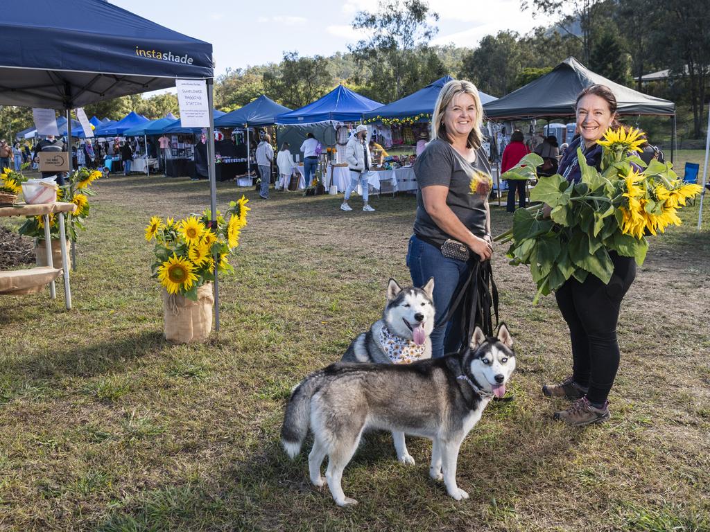 Sisters Sarah (left) and Rosemary Wallace with Fish (back) and Fern at the picnic with the sunflowers event hosted by Ten Chain Farm, Saturday, June 8, 2024. Picture: Kevin Farmer